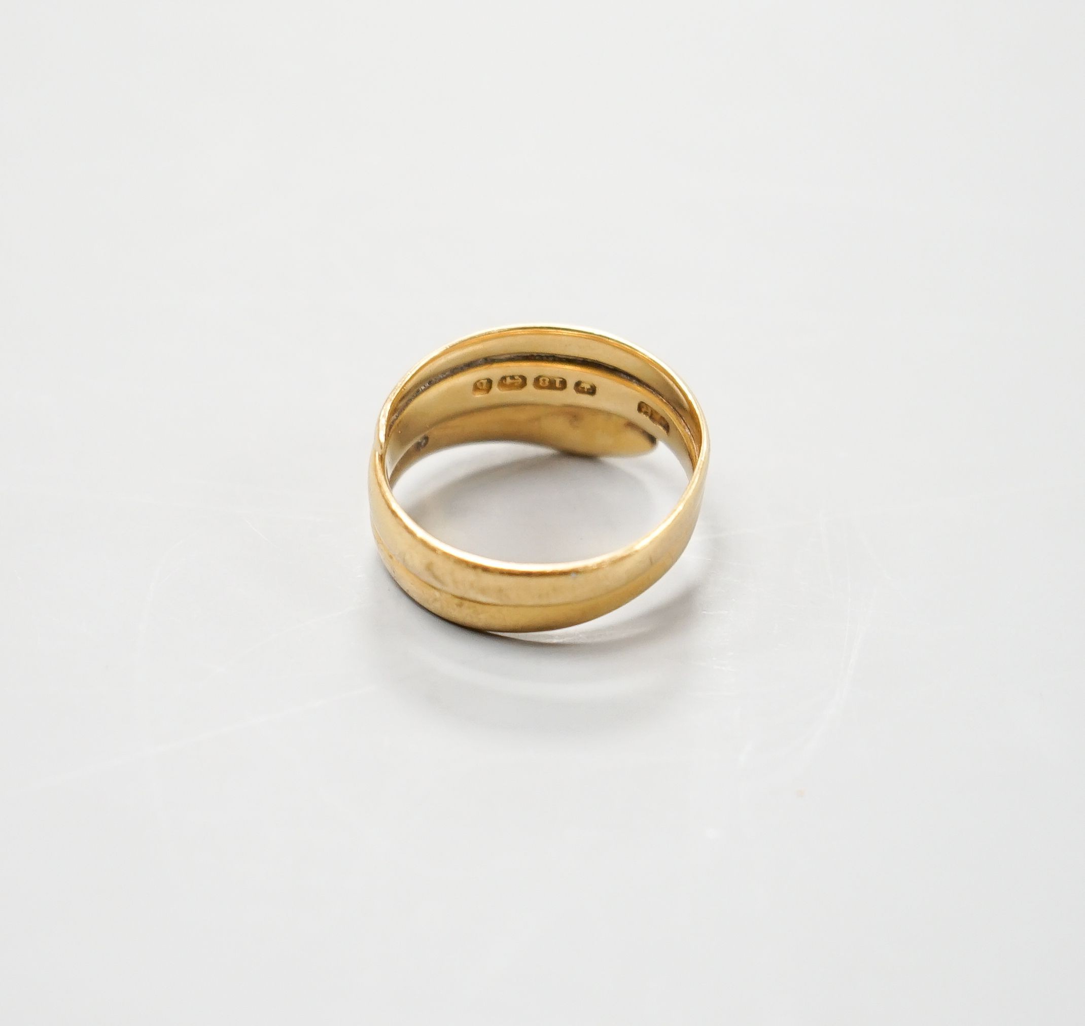 A late Victorian 18ct gold 'serpent' ring, hallmarked for Birmingham, 1876, size R/S, 8.5 grams.